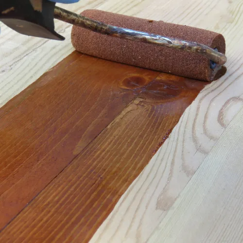 Wooden deck freshly stained with a rich brown finish, enhancing the outdoor space of a Cincinnati home.