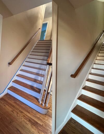 Staircase walls repainted in light gray tones