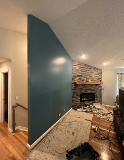 Living room accent wall painted in bold blue