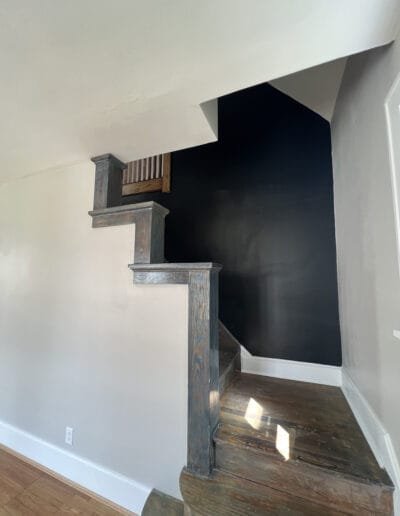 Interior staircase railing repainted in contrasting color