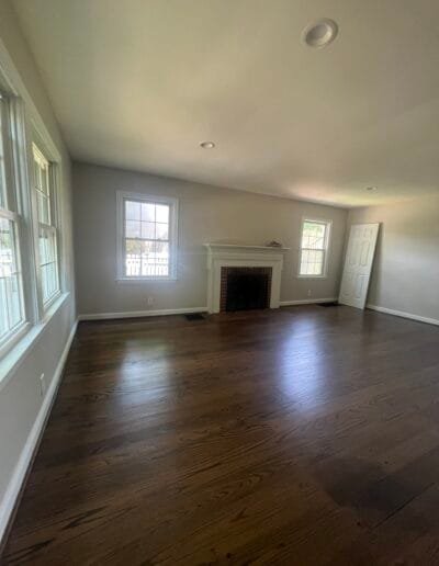 Farmhouse-style fireplace with solid white paint