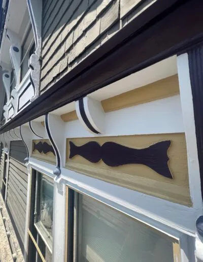 Custom-painted black trim accenting exterior siding.