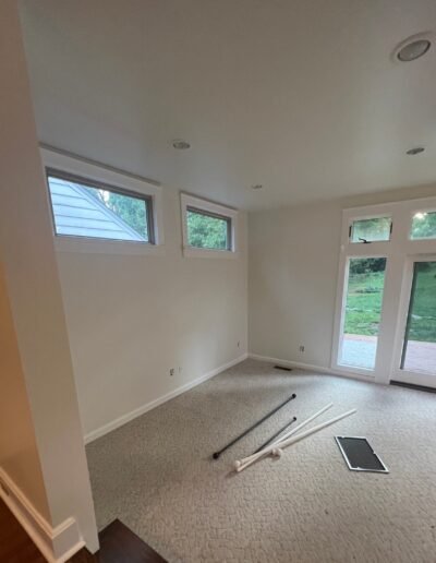 Guest room interior painted with fresh white tones and ceiling