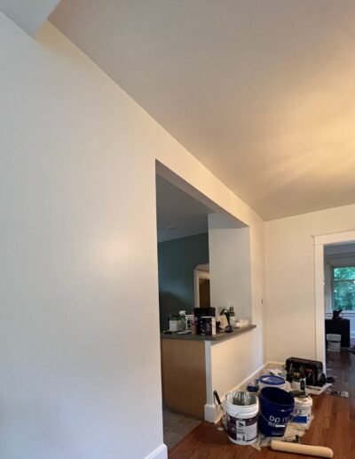 Living room ceiling painted to match trim