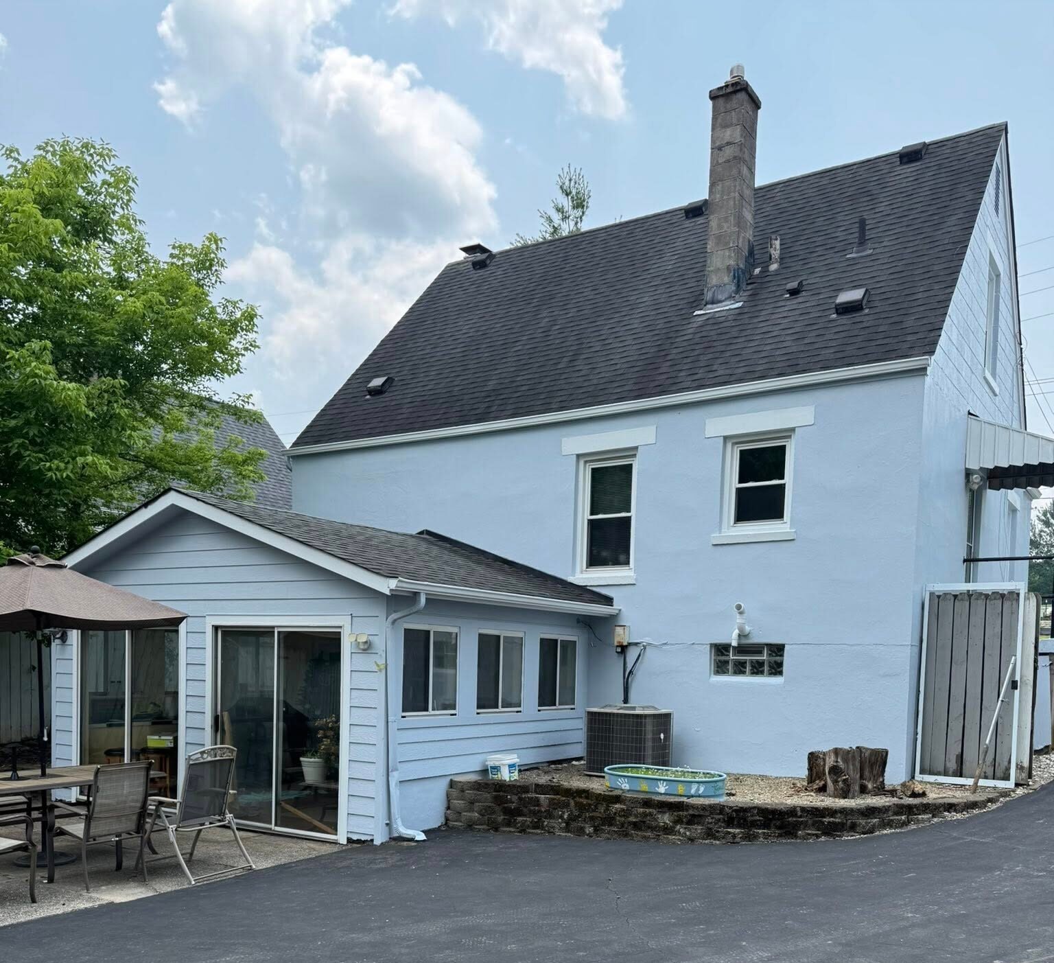 stucko brick and vinyl siding exterior painting Beautifully painted two-story home with a fresh gray and white exterior, showcasing Bishop Elite Painting’s exterior work.