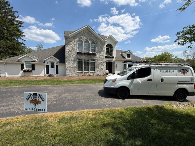 Bishop Elite Painting van on site during an exterior repaint of a stone and painted-brick home in Indian Hill, OH