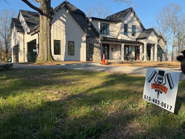 Exterior repaint in Indian Hill, OH in Benjamin Moore Olympic Mountain board-and-batten siding with Kendall Charcoal windows and trim, by Bishop Elite Painting